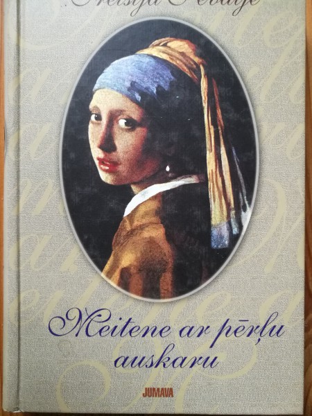 Meitene ar pērļu auskaru