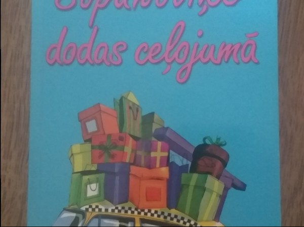 Šopaholiķe dodas ceļojumā