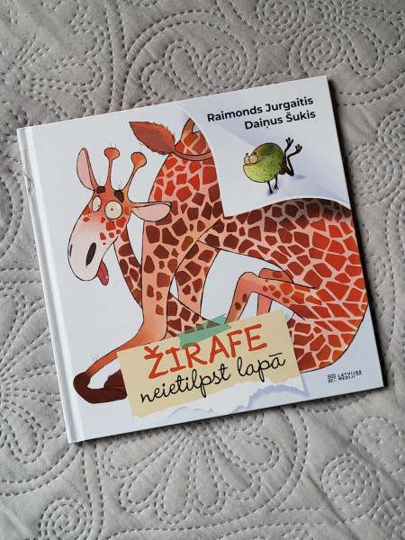 Žirafe neietilpst lapā